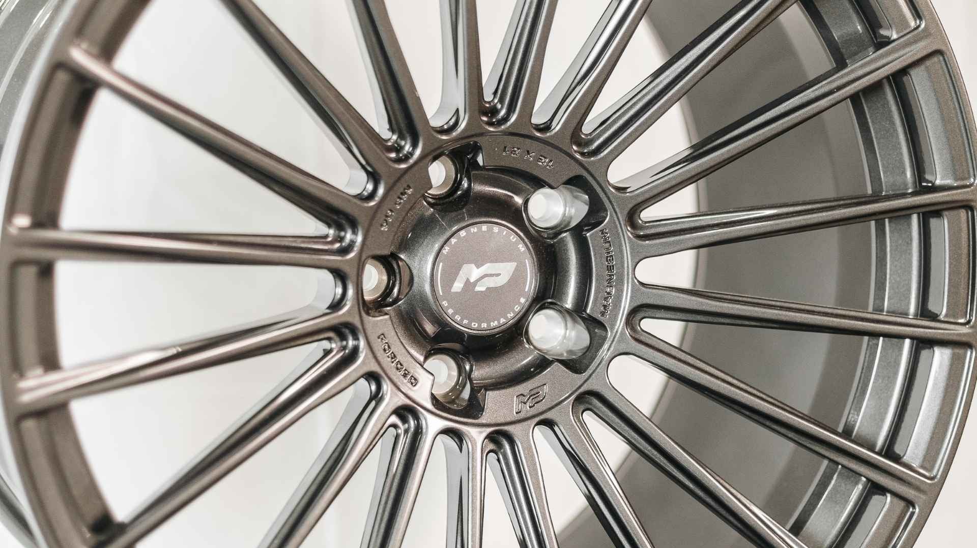 Close-up of forged magnesium Mopar wheels engineered by MP Wheels for modern Dodge muscle cars