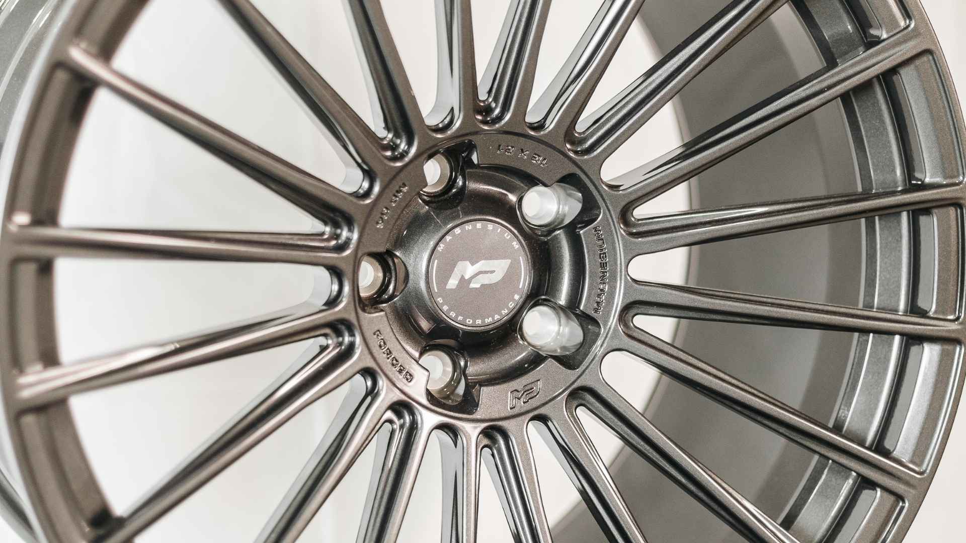 Close-up of forged magnesium Mopar wheels engineered by MP Wheels for modern Dodge muscle cars