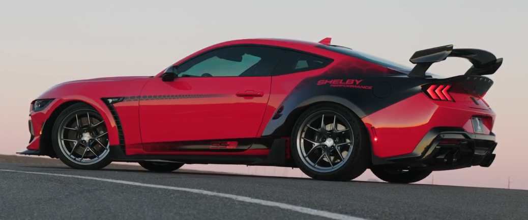 Close-up of MP01 forged magnesium wheels on a red Corvette, highlighting lightweight design and performance styling.