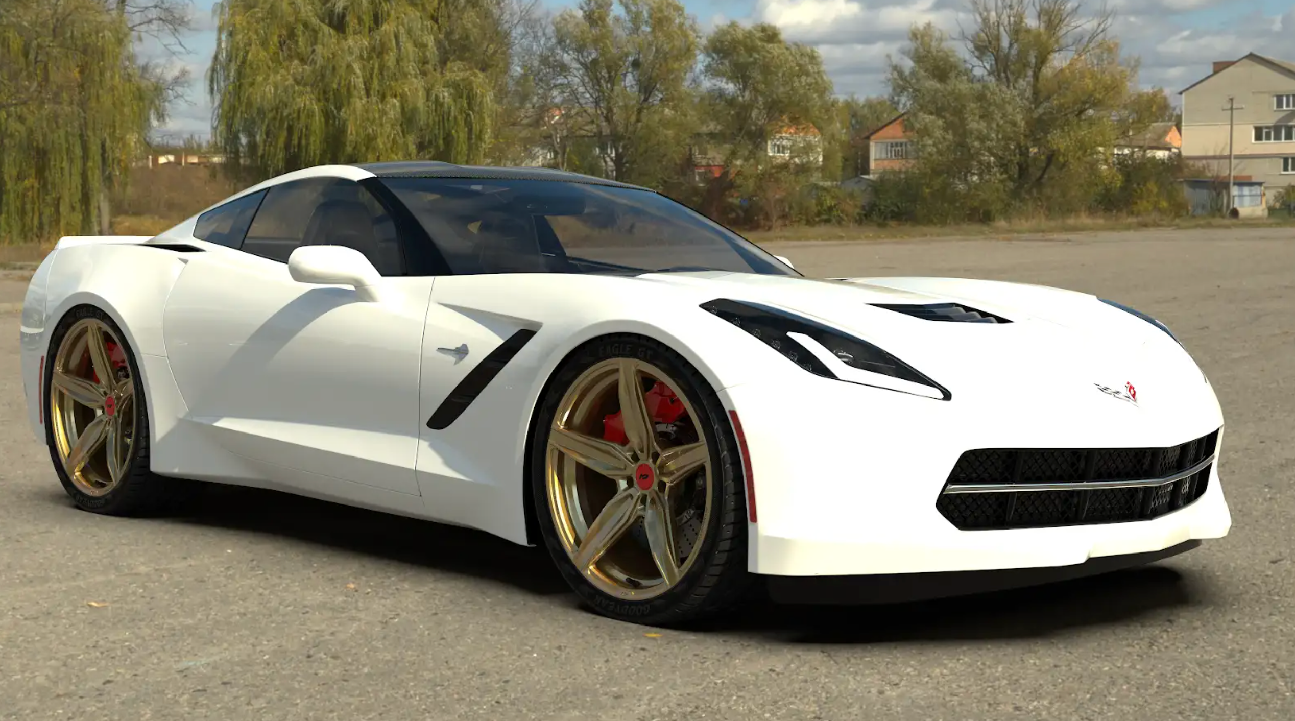 White Corvette C8 fitted with gold forged magnesium rims parked outdoors.